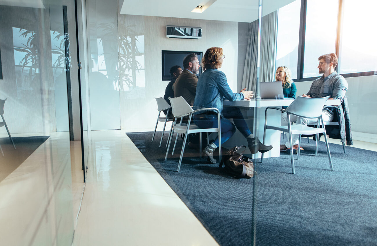 Group of business people having discussion in conference room